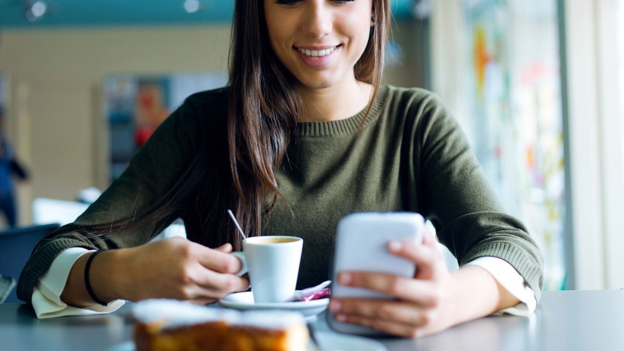 Woman Using Finch App for Habit Tracking