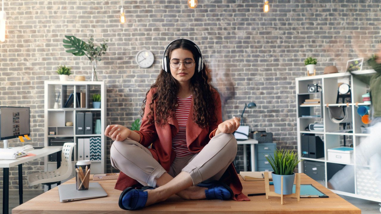 Woman Using Stress Relief App to Calm Down at Work