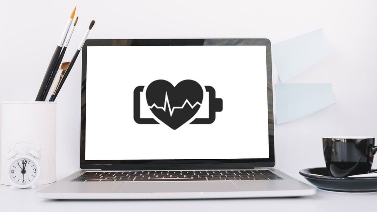 laptop with black healthy battery icon on screen
