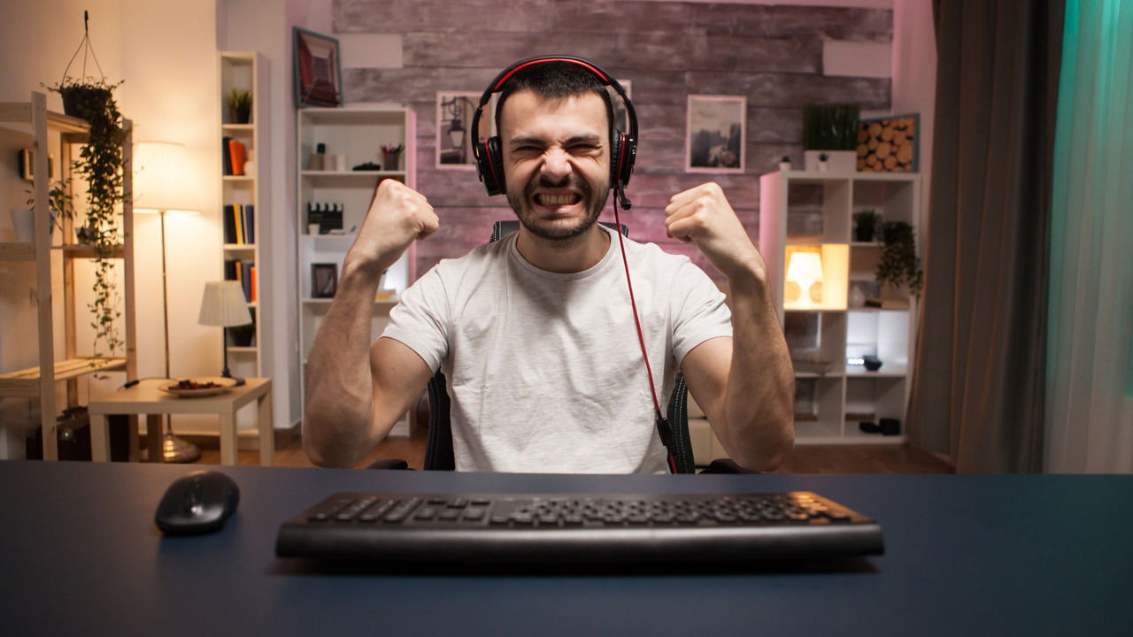 Man celebrating after in winning in video game